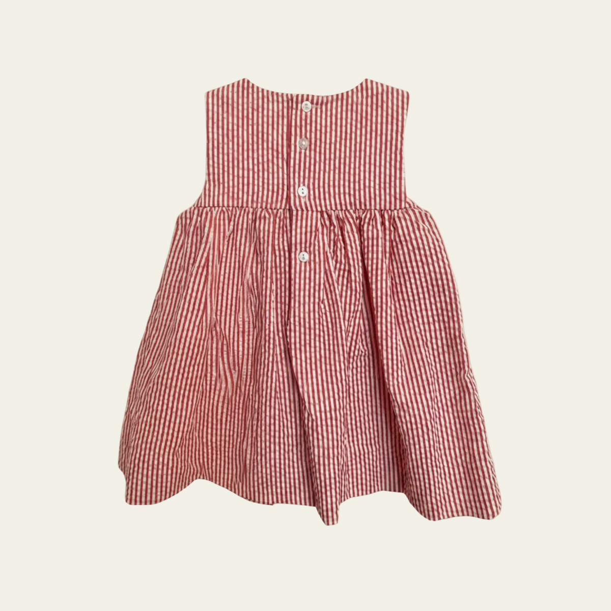 Petit Ami red and white stripe seersucker sundress, back, showing the buttoned closure