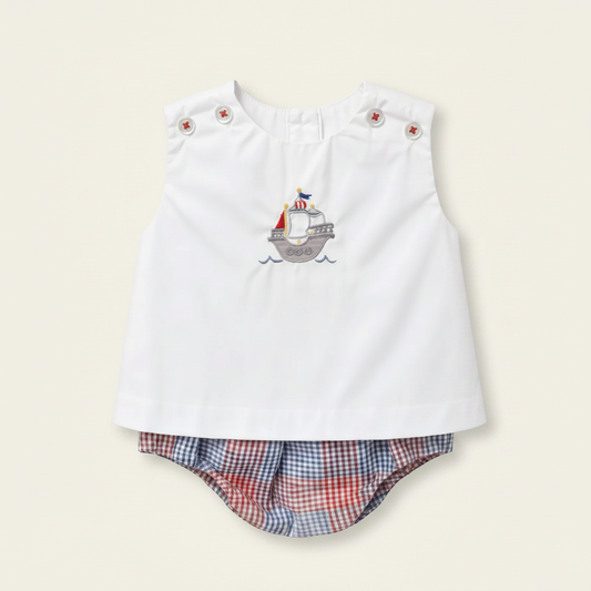 Petit Ami white top embroidered with a sailboat over red and blue check bloomers, front