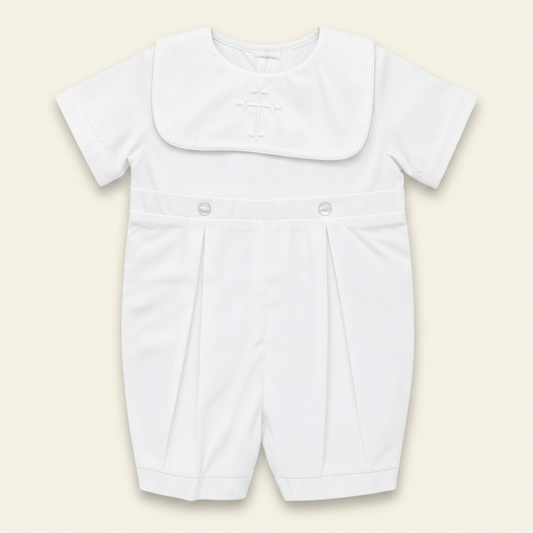Petit Ami white christening bobby suit with a hand-embroidered cross on the bib front