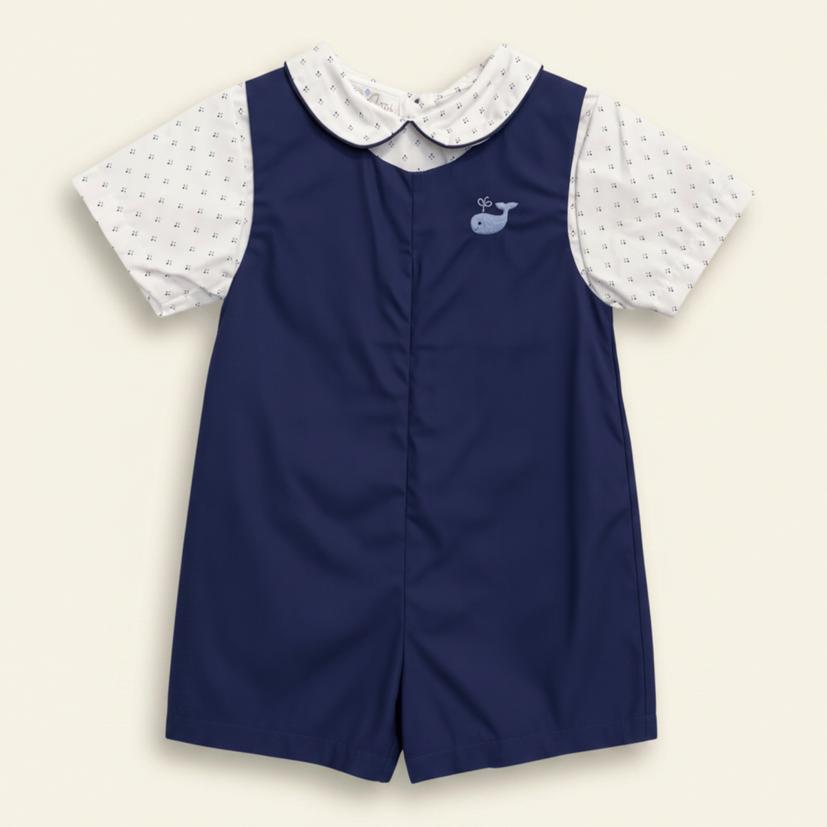 Petit Ami navy whale bobby suit, front, worn over a white foulard-print collar shirt
