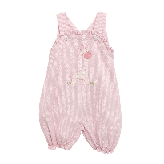 Petit Ami pink seersucker romper with an appliquéd giraffe and ruffled bib, front