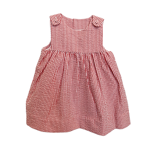 Petit Ami red and white stripe seersucker sundress, front, with buttoned shoulder tabs and a full gathered skirt
