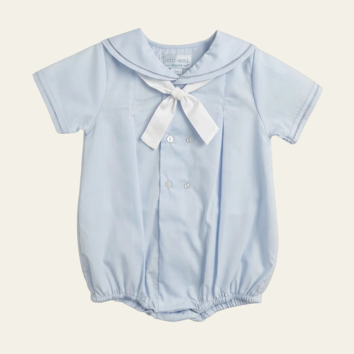 Petit Ami pale blue sailor bubble with white tie bow and embroidered anchors, front