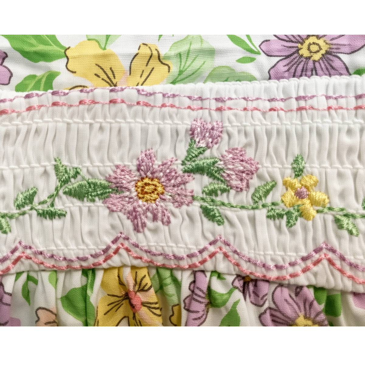 Detail of the hand-smocked and embroidered waist band on the floral sundress