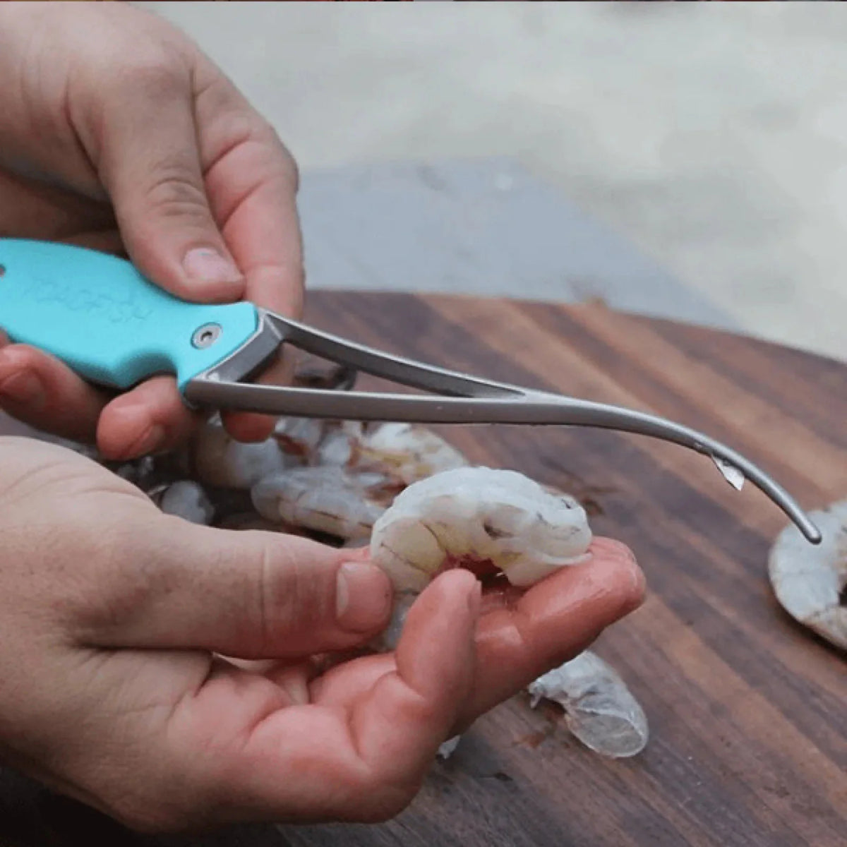 Toadfish Frogmore shrimp cleaner shown with coastal kitchen tools