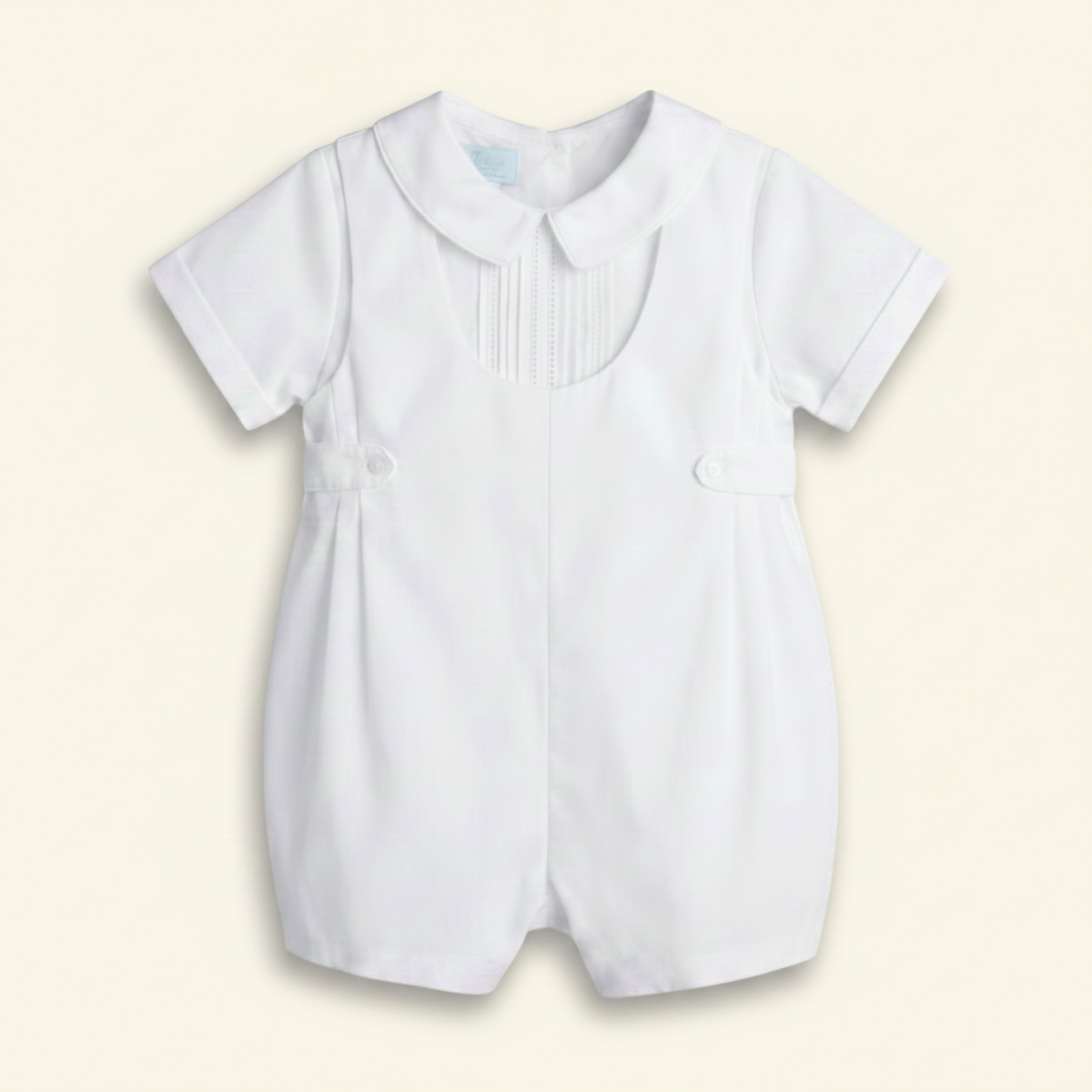 Petit Ami white christening shortall with pintucked and lace bib front, front
