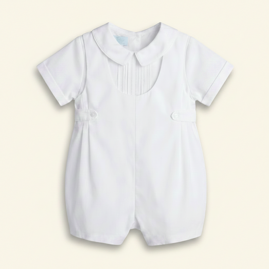 Petit Ami white christening shortall with pintucked and lace bib front, front